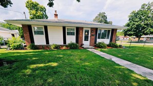 A single-story house with a brick facade, white siding, and a front porch. - Great for EAA rental!
Less than 2.5 miles from EAA grounds! (Oshkosh)