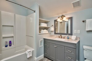 Bathtub, hair dryer, towels