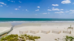A beach with a wooden fence and a wooden structure. - e2 sunrise point (Myrtle Beach)