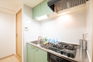 Twin Room | Private kitchen | Fridge, microwave