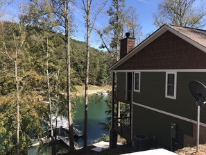 Situated lakeside, this cabin offers a tranquil retreat with a chimney and dock access.