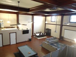 Relax in a spacious living area with a pool table and dining space for four.