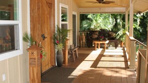 A wooden porch with a ceiling fan, a wooden door, and a bench. - *Peace and Serenity* (Haiku)