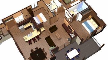 A 3D floor plan of a hotel with multiple rooms, a dining area, and a small outdoor seating space.