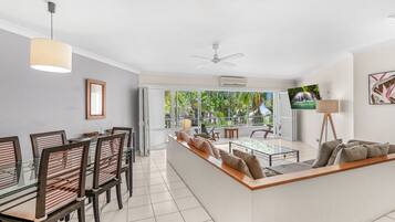 Classic Apartment, 2 Bedrooms, Pool View | Living room | 50-inch flat-screen TV with digital channels, TV