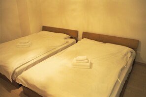 Habitación con 2 camas individuales | Wifi gratis y ropa de cama 