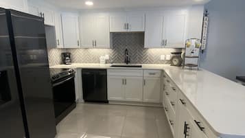 Condo, 3 Bedrooms | Private kitchen | Fridge, microwave, dishwasher, coffee/tea maker