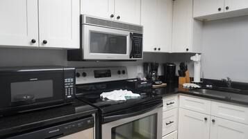 Condo, 2 Bedrooms | Private kitchen | Coffee/tea maker, fridge, dishwasher
