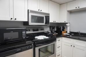 Condo, 2 Bedrooms | Private kitchen | Fridge, dishwasher, coffee/tea maker
