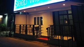A building with illuminated signage reading "Sleep with me" and "Sleep with me" in a larger font. - Sleep With Me Bangkok - BTS Phra Khanong (Bangkok)