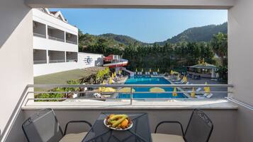 Room, Pool View | Minibar, desk, bed sheets