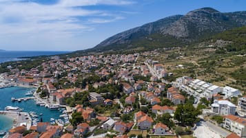 Experience the charm of a Mediterranean coastal town with its red-tiled roofs and picturesque marina.