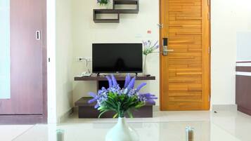 1-Bedroom Premium Room | Living area | Flat-screen TV