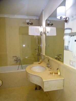 Rainfall showerhead, designer toiletries, hair dryer, slippers