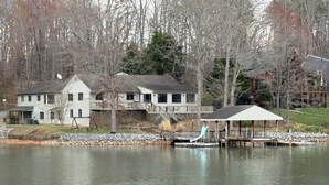 A lakeside property with a dock, a gazebo, and a house with a deck. - A Second Wind! With Sliding board/diving board!! (Huddleston)