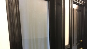 A dark wooden door with a frosted glass window. - Studio Loft in historic Silverton Building (Silverton)