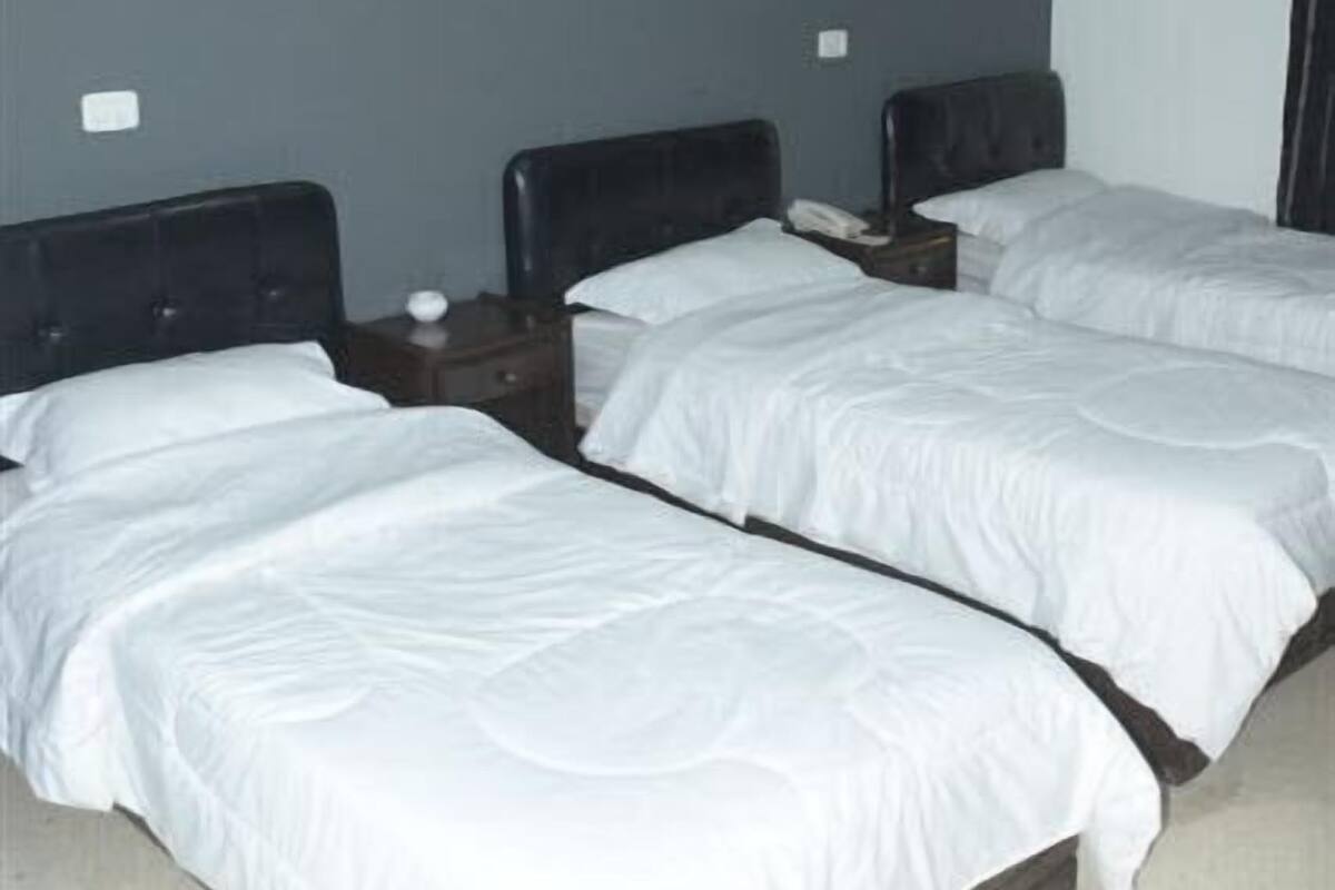 Triple Room | In-room safe, blackout drapes, WiFi (free), bed sheets