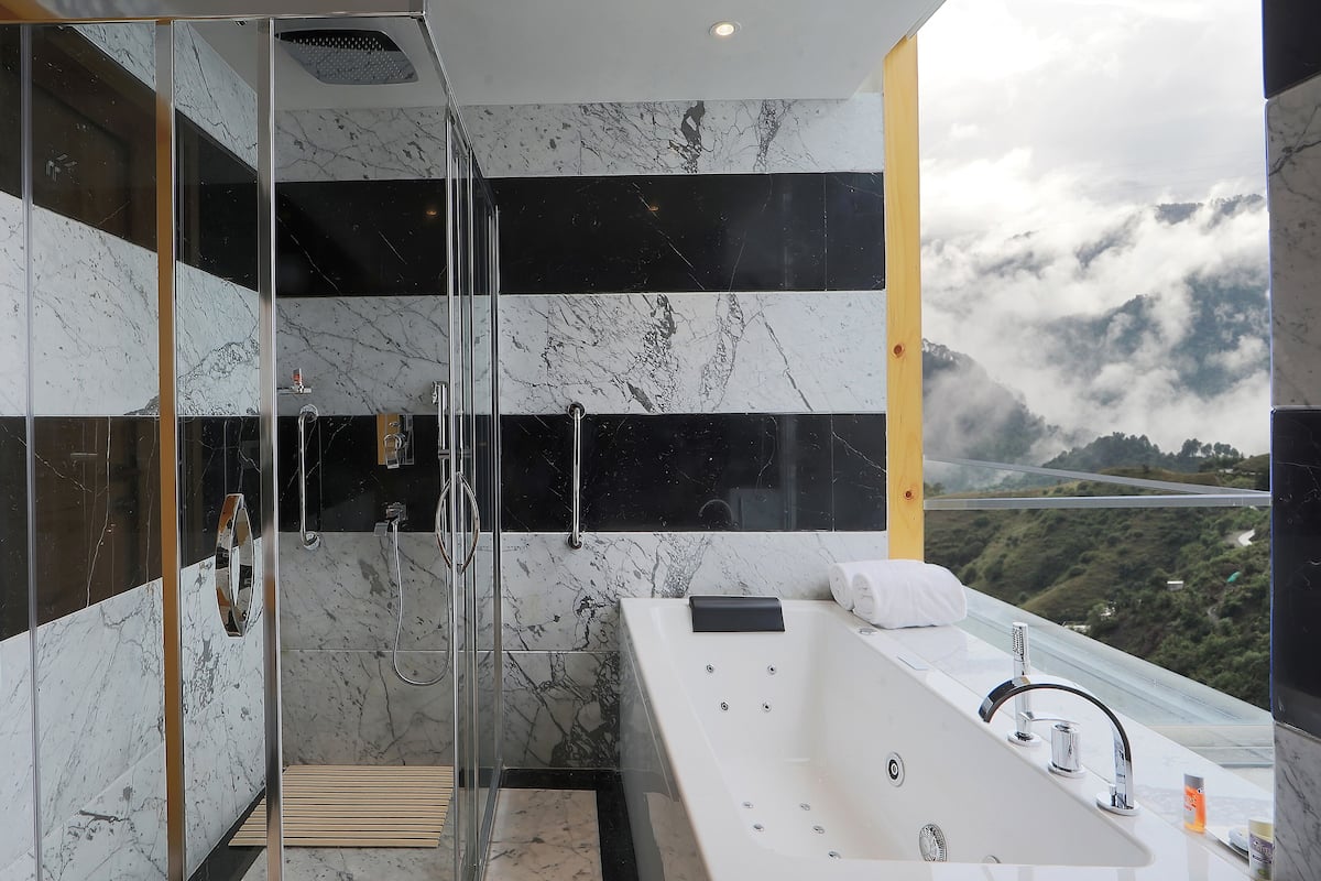 suite, 1 queen bed, garden view | bathroom | shower, free toiletries, bathrobes, slippers