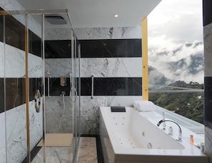Suite, 1 Queen Bed, Garden View | Bathroom | Shower, free toiletries, bathrobes, slippers