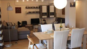 Comfort Apartment | Living area | Plasma TV