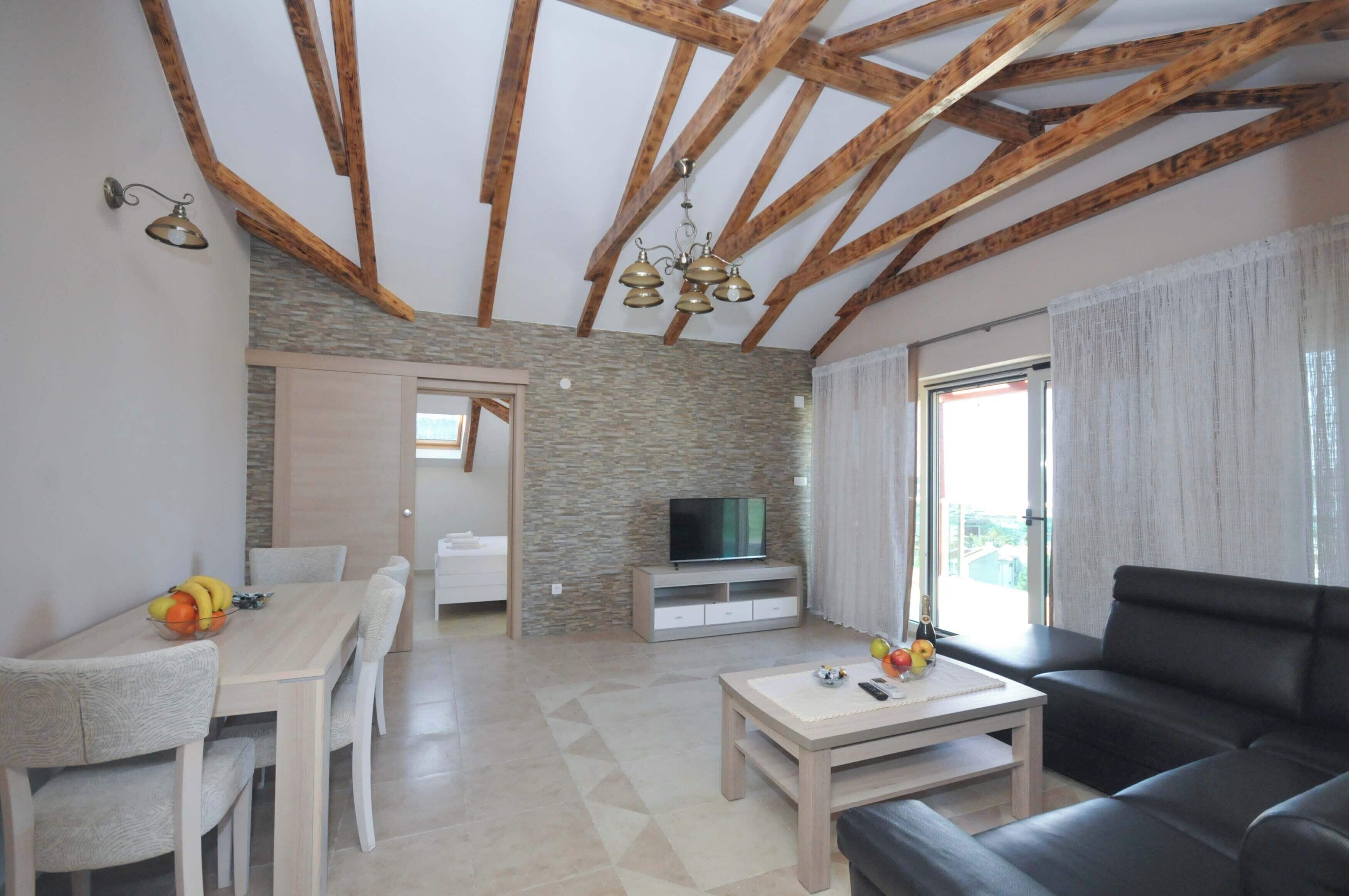 Deluxe Apartment, 4 Bedrooms (A4) | Living area | Flat-screen TV