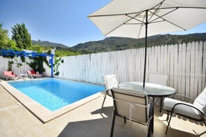 Outdoor pool, pool umbrellas, pool loungers