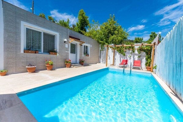 Outdoor pool, pool umbrellas, pool loungers