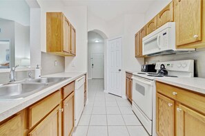 Condo | Private kitchen | Dishwasher, cookware/dishes/utensils