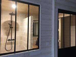 Shower, hair dryer, soap, toilet paper