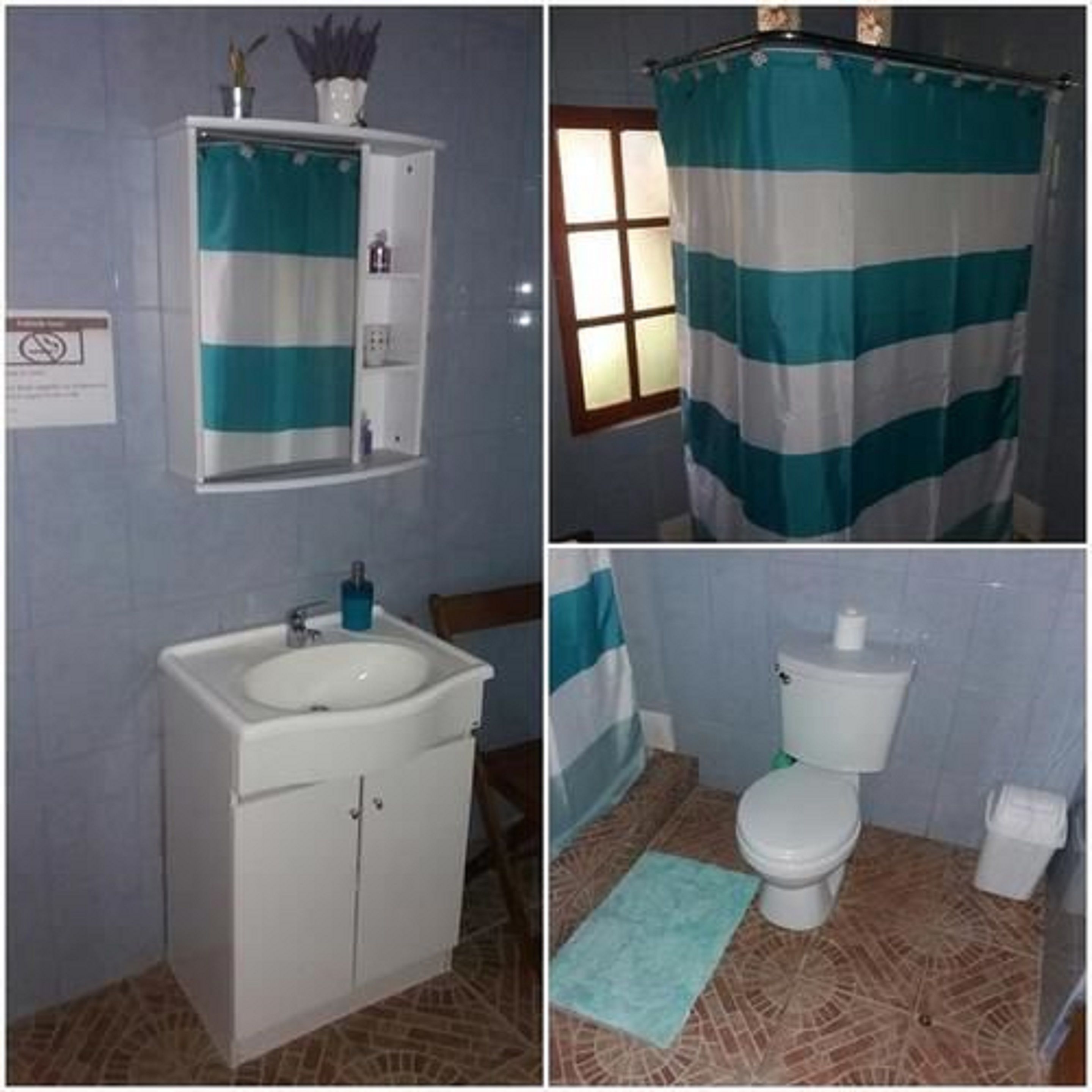 Un bagno con lavandino, specchio e water.