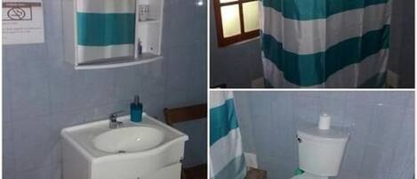 A bathroom with a sink, mirror, and toilet.