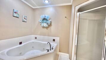 Bathtub, jetted tub, hair dryer, towels
