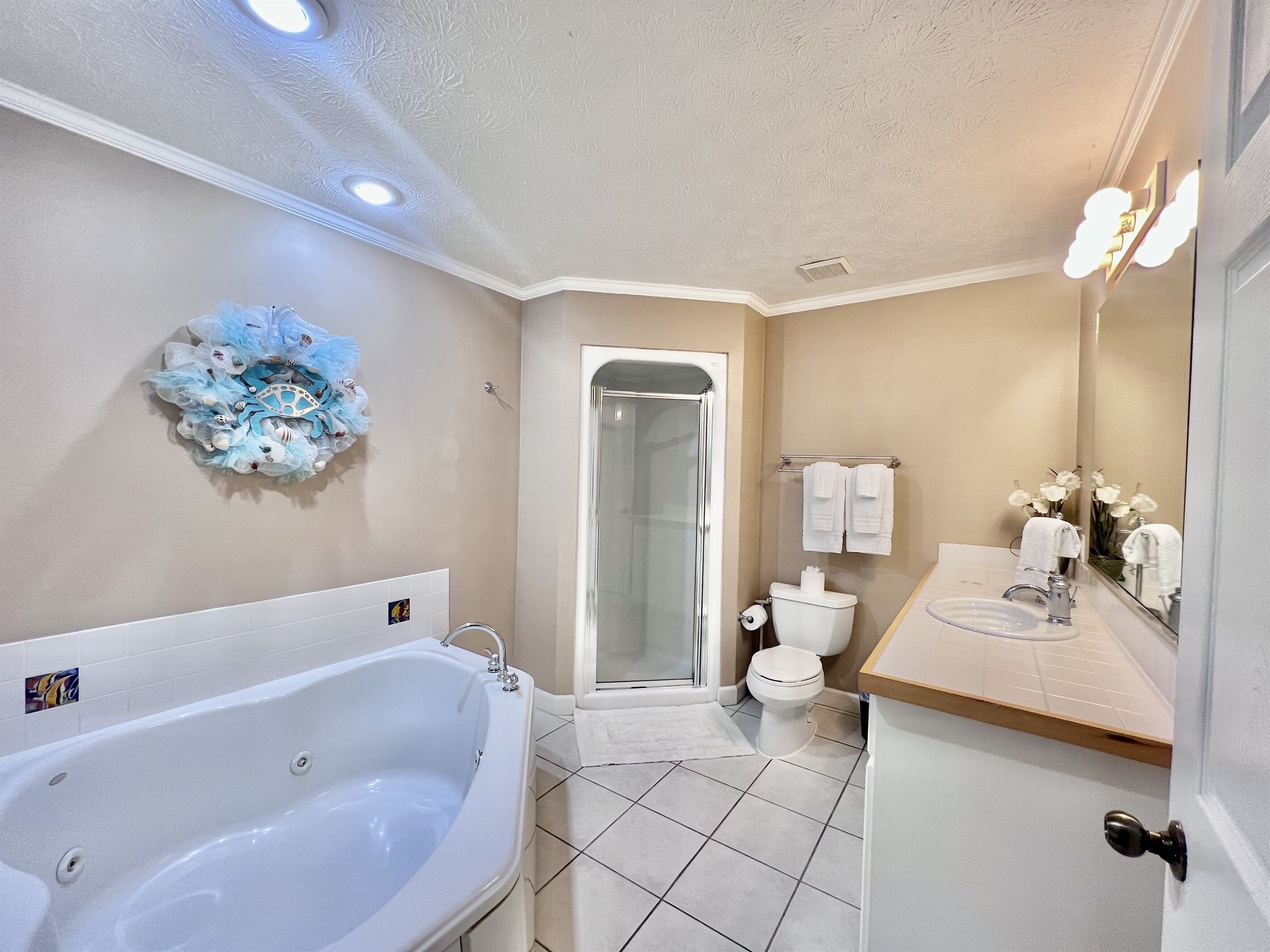 Bathtub, jetted tub, hair dryer, towels