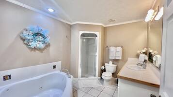 Bathtub, jetted tub, hair dryer, towels