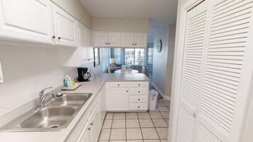 Condo, 2 Bedrooms | Private kitchen | Fridge, microwave, oven, dishwasher