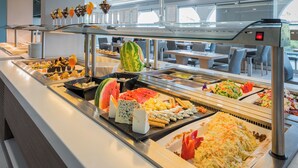 A buffet with various food items and a salad bar. - Karras Grande Resort (Zakynthos)
