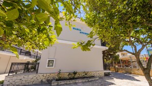 A building with a sign reading "Maria Studio." - Karras Livin (Zakynthos)