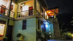 A multi-story building with balconies and a staircase. - The Tamarind (Kandy)