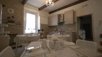 Mini-fridge, oven, stovetop, cookware/dishes/utensils