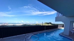 A swimming pool with a view of the beach and ocean. - Florence I 608 Minium Studio Bedroom Condo by RedAwning (South Padre Island)