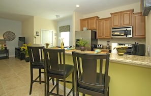 Fridge, microwave, stovetop, cookware/dishes/utensils