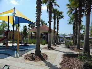 Explore the outdoor play area with a children's play structure, pavilion, and beautifully manicured surroundings.