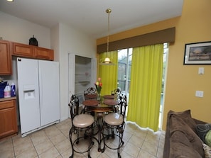Cozy living space with a kitchenette, dining area, and comfortable seating.
