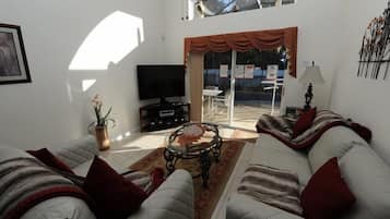 House | Living area | Flat-screen TV, foosball, printers