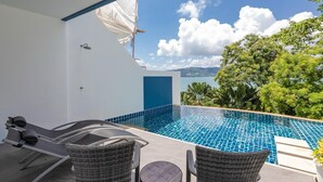 An outdoor infinity pool with a view of the sea and mountains, surrounded by wicker furniture and a small table. - Villa 29/6 Ocean front pool villa (Tambon Patong)