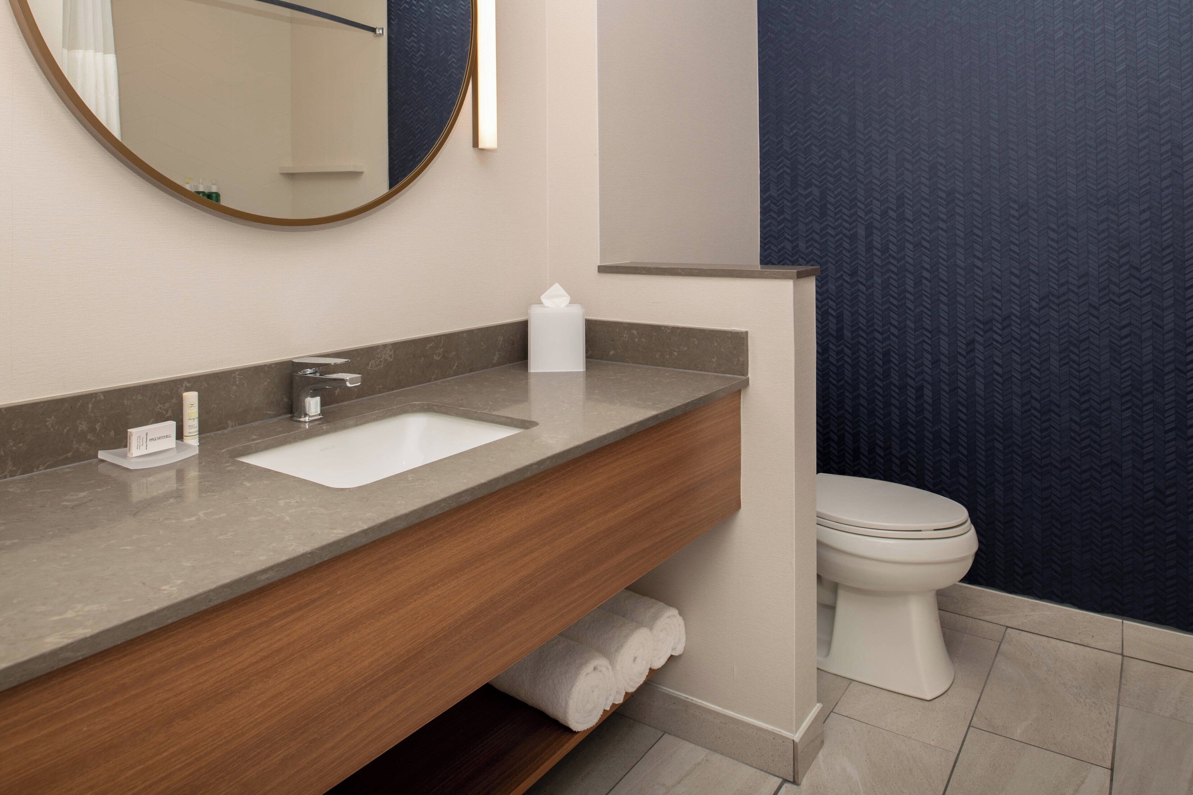 shower, designer toiletries, hair dryer, towels