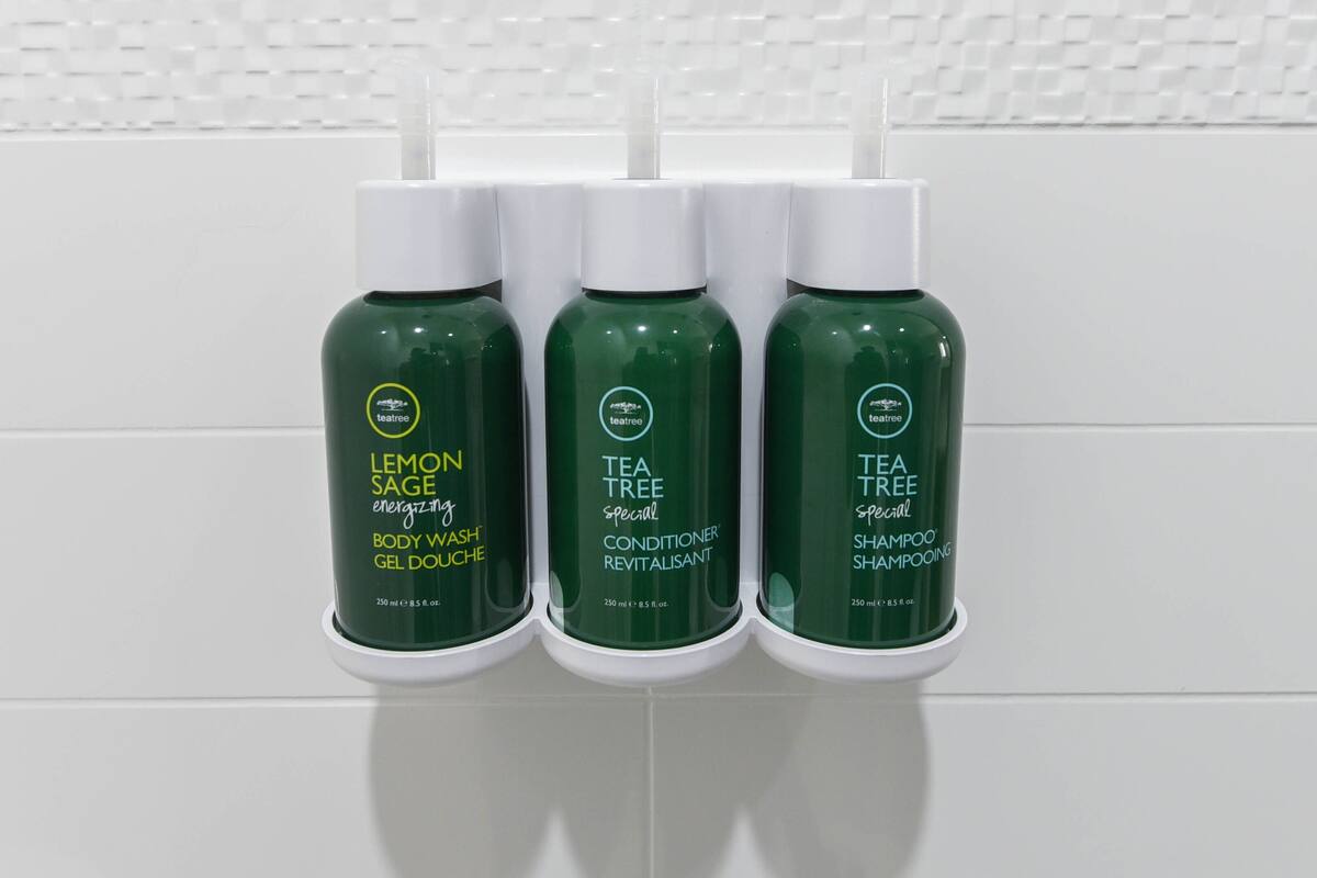 shower, designer toiletries, hair dryer, towels