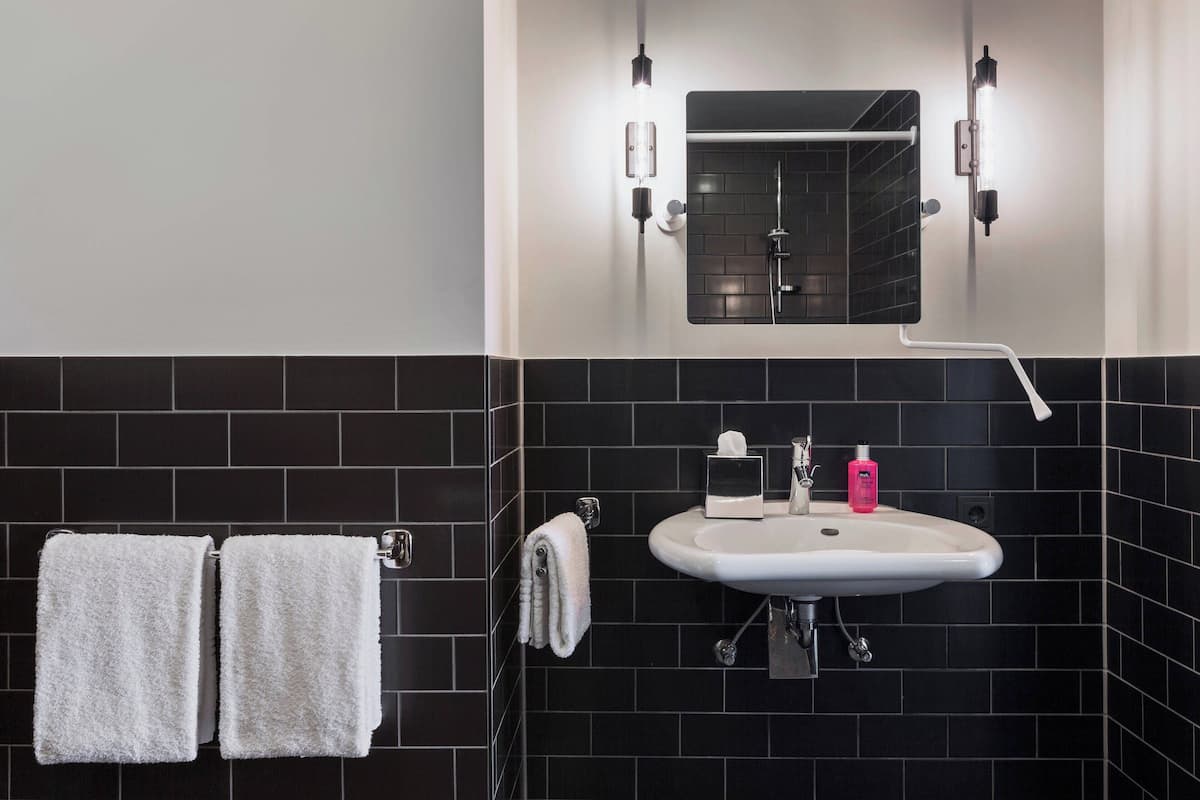 room, 1 queen bed with sofa bed | bathroom | shower, free toiletries, hair dryer, towels