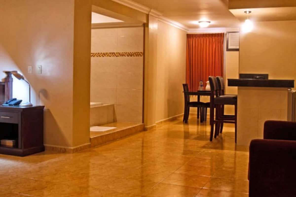 suite, 1 king bed, non smoking | in-room safe, desk, free wifi, bed sheets