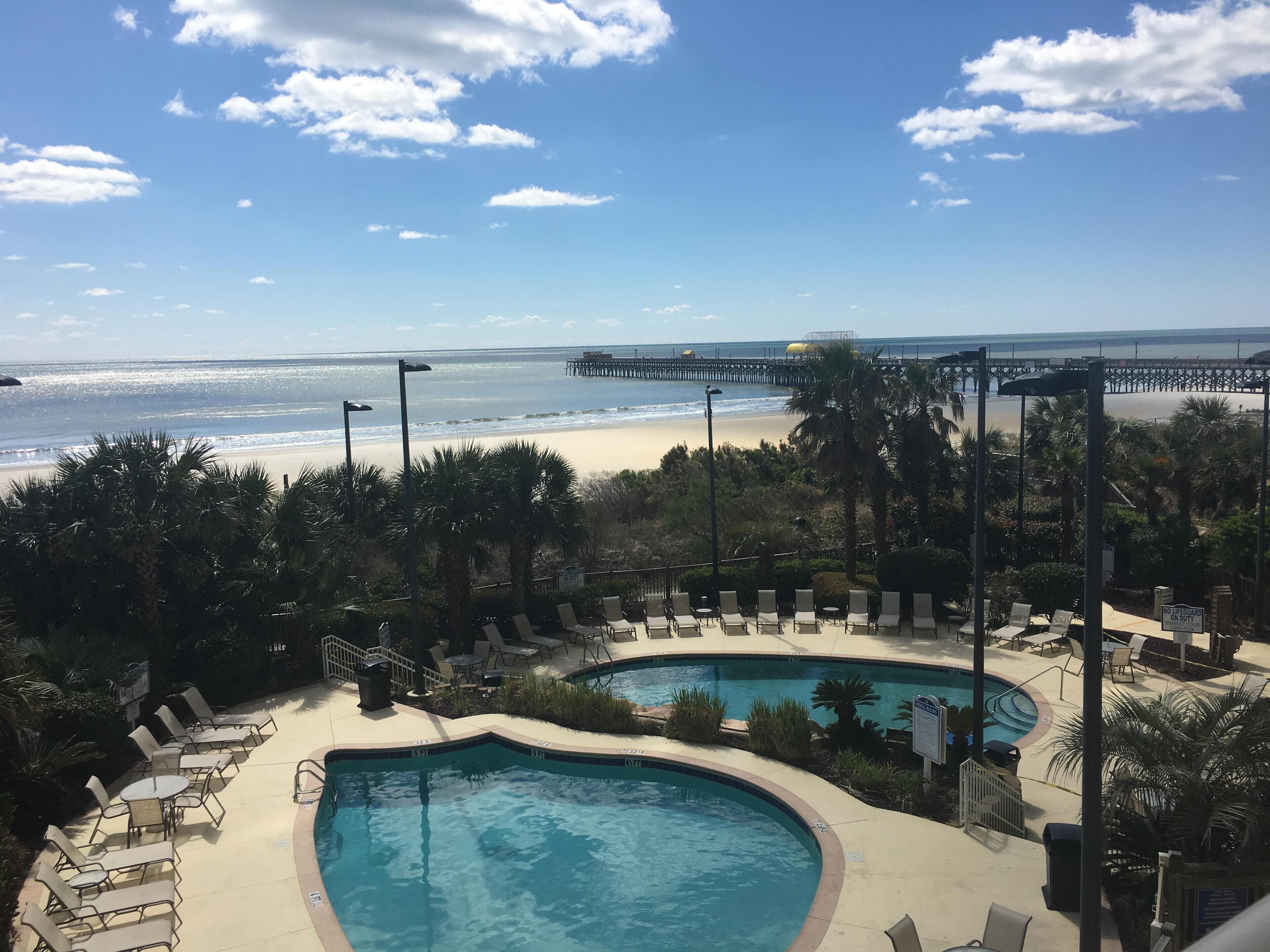 OCEANFRONT OASIS.  Waves echo throughout this cozy family condo. 